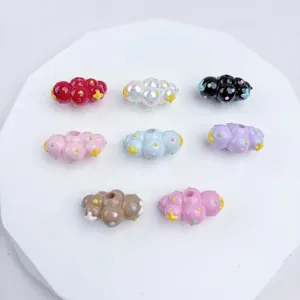 Detailed view of colorful hand-painted cloud-shaped beads for DIY jewelry crafts.