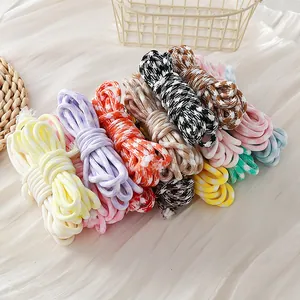 Macro view of colorful 5mm houndstooth braided paracord ropes for DIY crafts