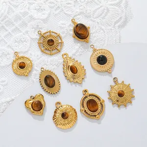Detailed close-up view of gold stainless steel tiger eye pendants for DIY jewelry making