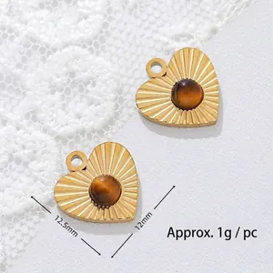 Close-up of 12.5mm heart tiger eye pendant in 18K gold plated stainless steel