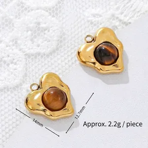 Detail view of 18K gold-plated tiger eye heart pendants showing 14mm and 12.7mm measurements