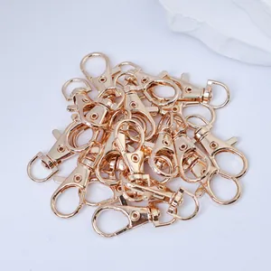 Close-up view of golden alloy lobster clasps for DIY jewelry making and bag accessories