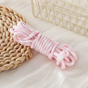 Close-up detail of the pink and white 5mm houndstooth pattern braided polyester cord