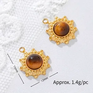 Detail view of gold-plated tiger eye sun pendants with dimensions of 15mm and 12mm.