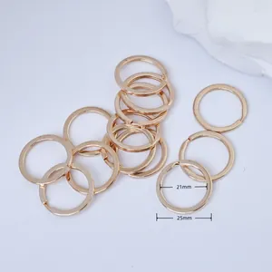 Detail of gold alloy split key rings with 21mm inner and 25mm outer diameters.