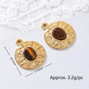 Close-up of tiger eye stone pendants with 18K gold plated stainless steel