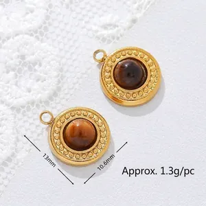 Detailed view of 18K gold plated stainless steel pendants with natural tiger eye stones.