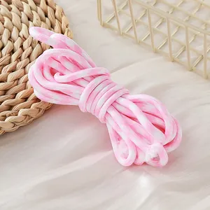 Detailed view of 5mm pink and white houndstooth patterned polyester DIY craft rope