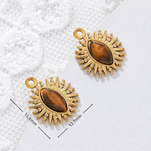 Detailed macro view of 18K gold plated tiger eye sun charms with size and weight info