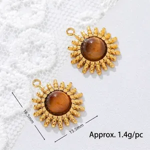 Close-up of golden sun pendant with tiger eye stone and dimension markings