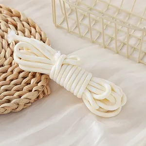 Macro detail of white 5mm braided polyester cord for DIY crafts and accessories