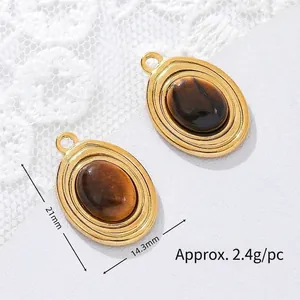 Detailed view of gold plated oval tiger eye stone pendant with size and weight info