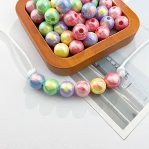 Close-up view of colorful UV heart-printed acrylic beads with 3mm holes for DIY jewelry