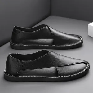 Detailed view of black men's vintage hollow slip-on loafers featuring breathable soft soles