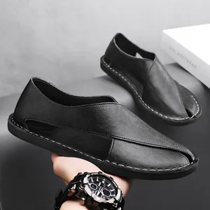 Close-up of black hollow leather casual sandals with soft sole and slip-on design