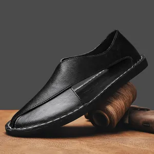Detail of handmade black hollow sandals with premium leather texture and stitching