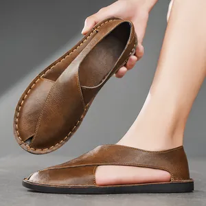 Detailed macro view of vintage brown leather sandals showing side cut-outs and stitching.