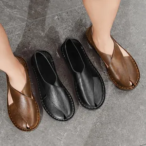 Detailed top view of handmade vintage leather loafers featuring a unique hollow design and cross straps