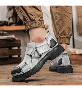 Detailed side view of men's chunky silver leather work shoes with durable thick soles