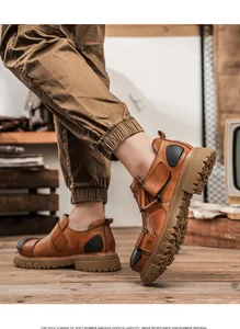 Close-up of men's premium leather industrial low-top shoes with thick rubber soles.