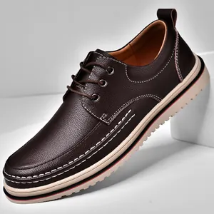 Classic dark brown men's pebbled leather business casual shoes on white platform.