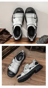 Close-up detail of men's distressed grey leather work shoes featuring chunky round toe design