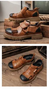 High-quality brown cowhide leather work shoes with black toe caps and rugged rubber soles.
