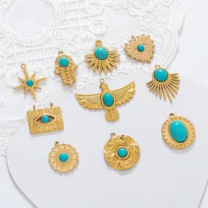 Detailed macro view of assorted 18K gold plated turquoise charms for DIY jewelry making.