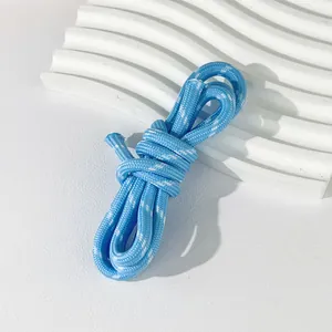 Macro view of 5mm blue and white woven polyester cord for DIY crafts and jewelry.