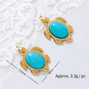 Close-up detail of 18K gold plated turtle pendant with turquoise stone and dimensions