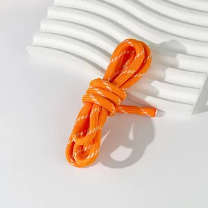 Detailed view of 5mm orange braided polyester cord for DIY bag charms and jewelry