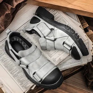Vintage distressed leather round toe work shoes for men with thick black soles.