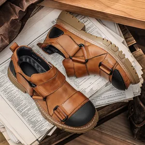 Vintage brown leather work shoes with black round toe and thick rubber lug sole.