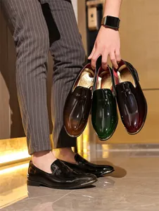 Macro view showing multiple colors of premium glossy patent leather men's loafers