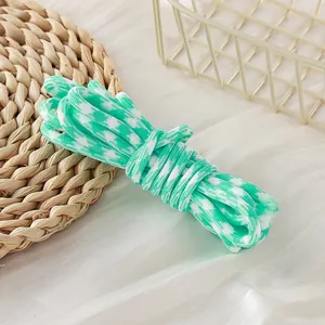 Macro view of 5mm green houndstooth pattern paracord bundle for DIY craft projects
