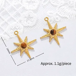 Detailed macro view of 18K gold plated star pendant with tiger's eye stone and measurements.