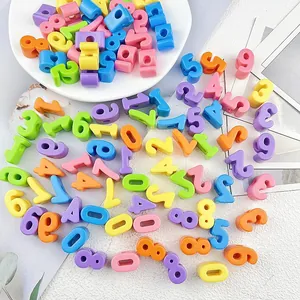 Vibrant 6mm large hole acrylic number beads scattered for DIY jewelry craft projects