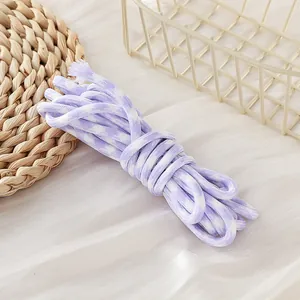 Macro view of 5mm purple houndstooth woven paracord for DIY lanyards and crafts.