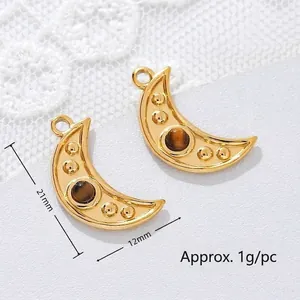 Detailed macro view of crescent moon pendant with tiger eye stone, 21mm x 12mm size