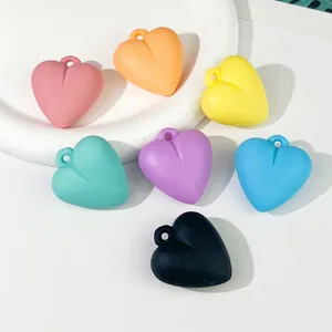 Assorted colorful matte acrylic heart pendants for DIY jewelry making and keychains.