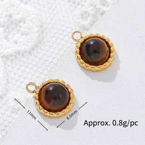 Macro view of tiger eye stone pendant showing 11mm diameter and 0.8g weight per piece