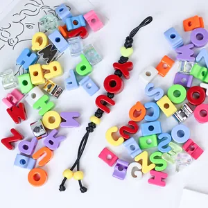 Close-up of vibrant 6mm acrylic letter beads and a DIY handmade colorful phone strap