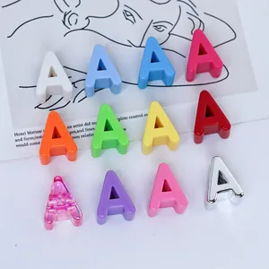 Detailed close-up of vibrant 6mm acrylic letter A charms in multiple colors for DIY crafts