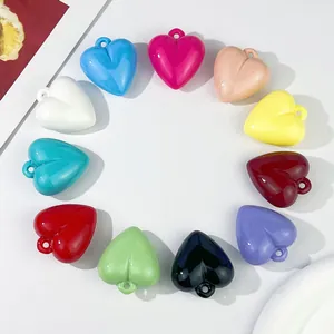 Top-down view of colorful 35x32mm heart-shaped acrylic pendants arranged in a circle