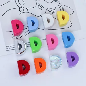 Close-up of colorful acrylic D-letter beads for DIY jewelry and phone chains