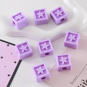 Close-up of purple star-shaped square acrylic beads for DIY jewelry and phone chains