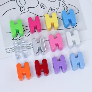 Detailed view of colorful 6mm H-shaped acrylic beads for DIY dopamine style phone chains