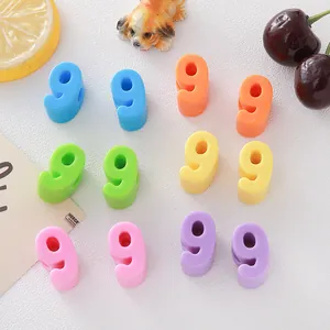Macro view of various colorful 6mm acrylic number beads for handmade jewelry accessories