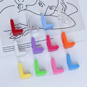 Close-up of colorful L-shaped acrylic beads for DIY personalized keychains and crafts
