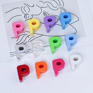 Close-up of colorful 6mm acrylic letter P beads for DIY jewelry and phone strap making.
